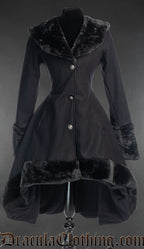 Women's black wool winter coat in short high low style with faux fur collar cuffs and hem