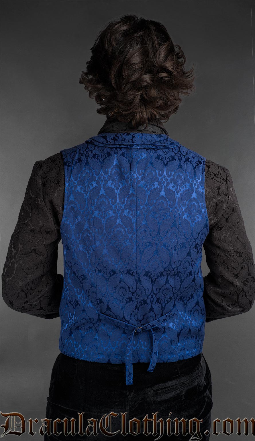 Back view of Men’s blue brocade double-breasted waistcoat worn over black shirt in gothic formal style