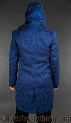 Back view of Men’s blue brocade gothic hooded jacket with velvet lapels and tailored fit
