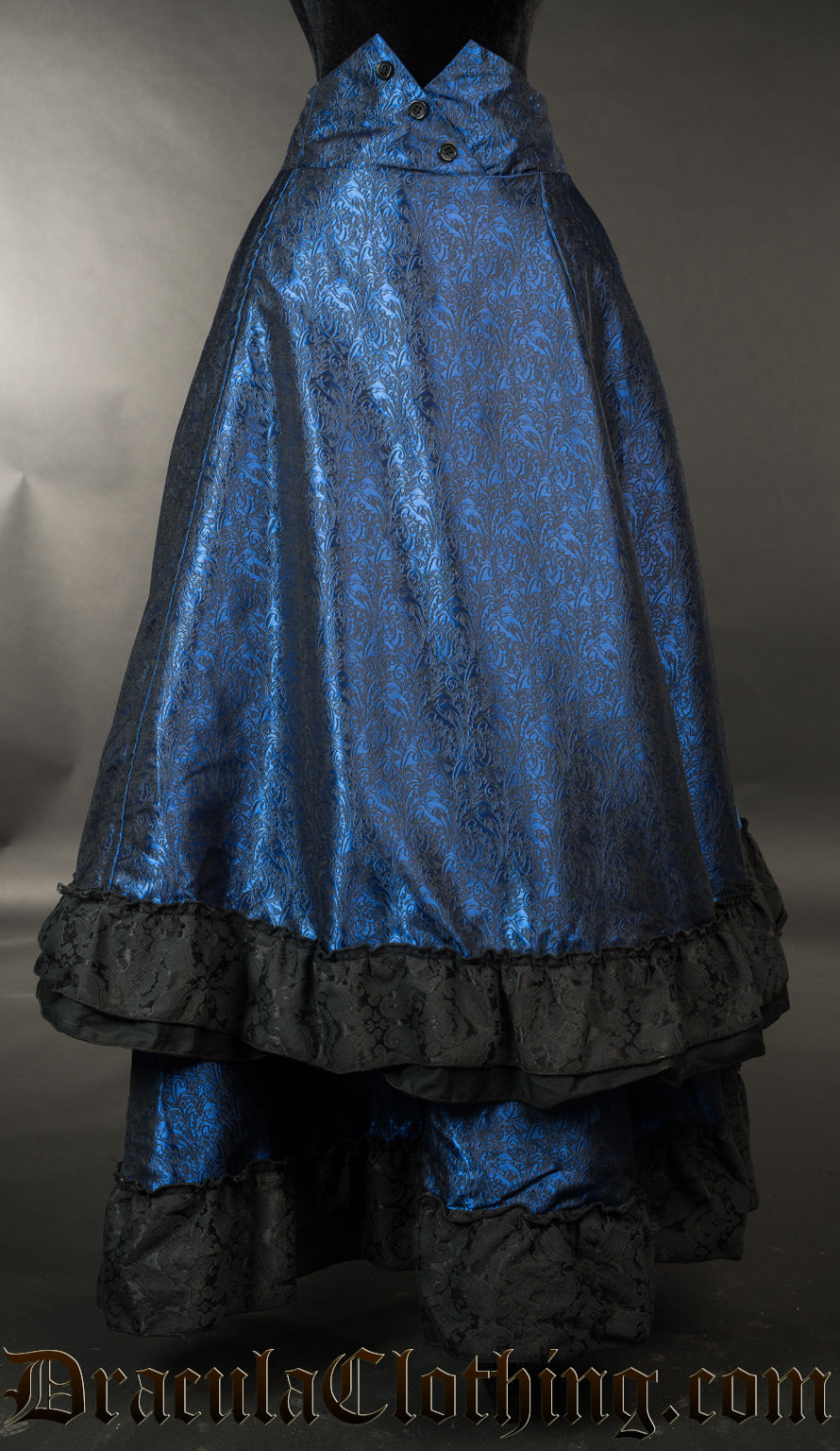 Front view of women's blue bustle skirt with front layer of fabric shown lowered to it's full length