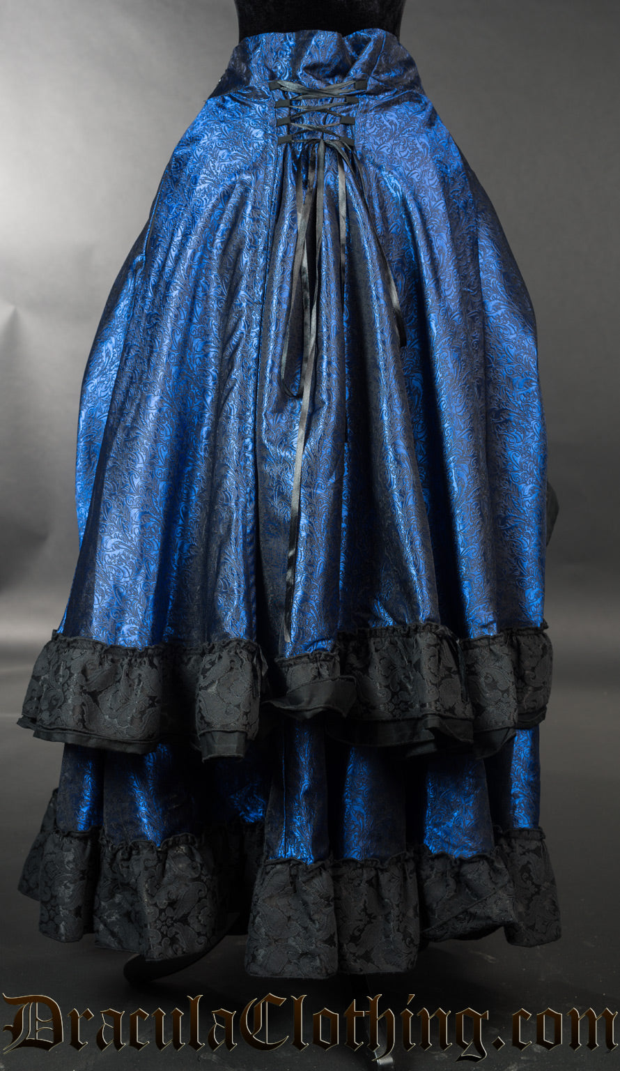 Back view of blue women's bustle skirt showing adjustable lacing in the waist and multiple layers of fabric
