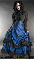 Women's high waisted blue bustle skirt with black brocade accents at the hem of each layer and buttons at the waist
