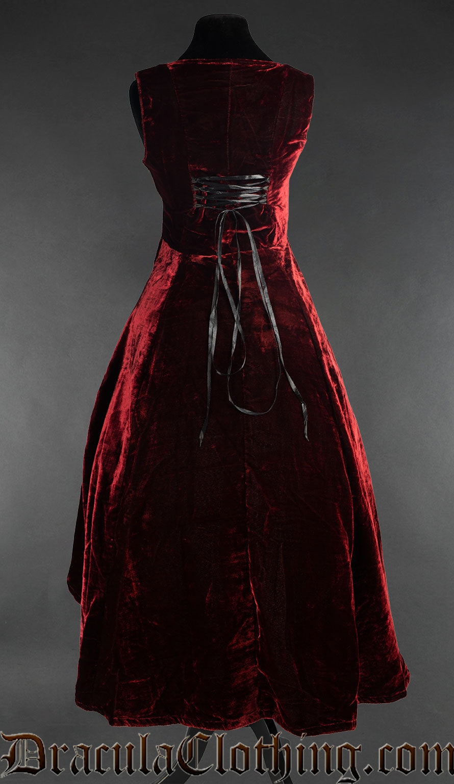 Back view of women's red velvet dress showing adjustable lacing tied with black ribbon