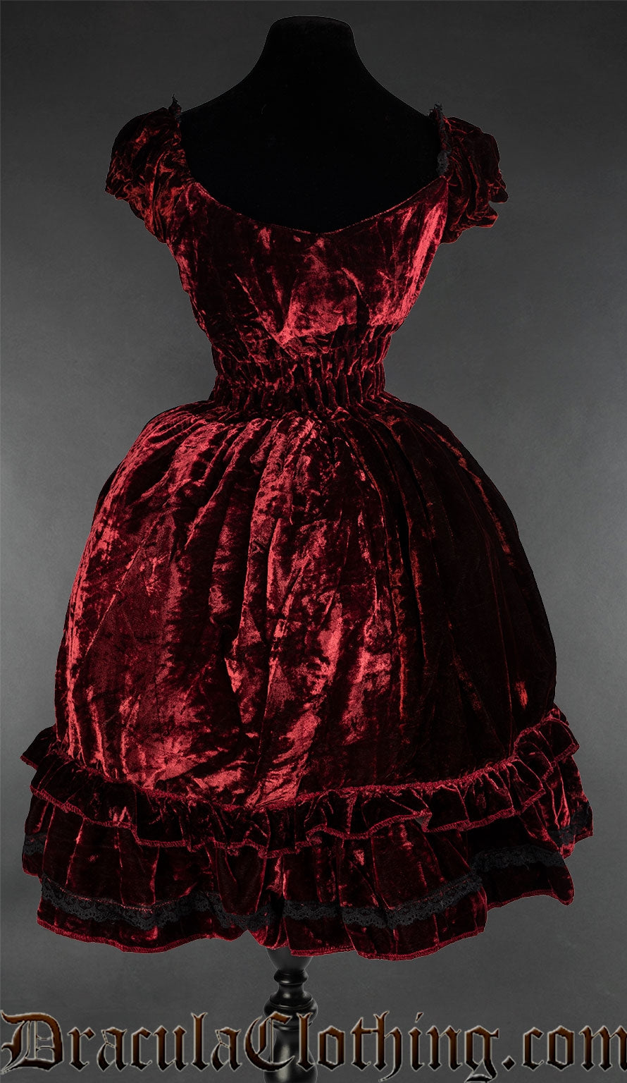 Back view of red women's velvet dress showing very elasticated waist
