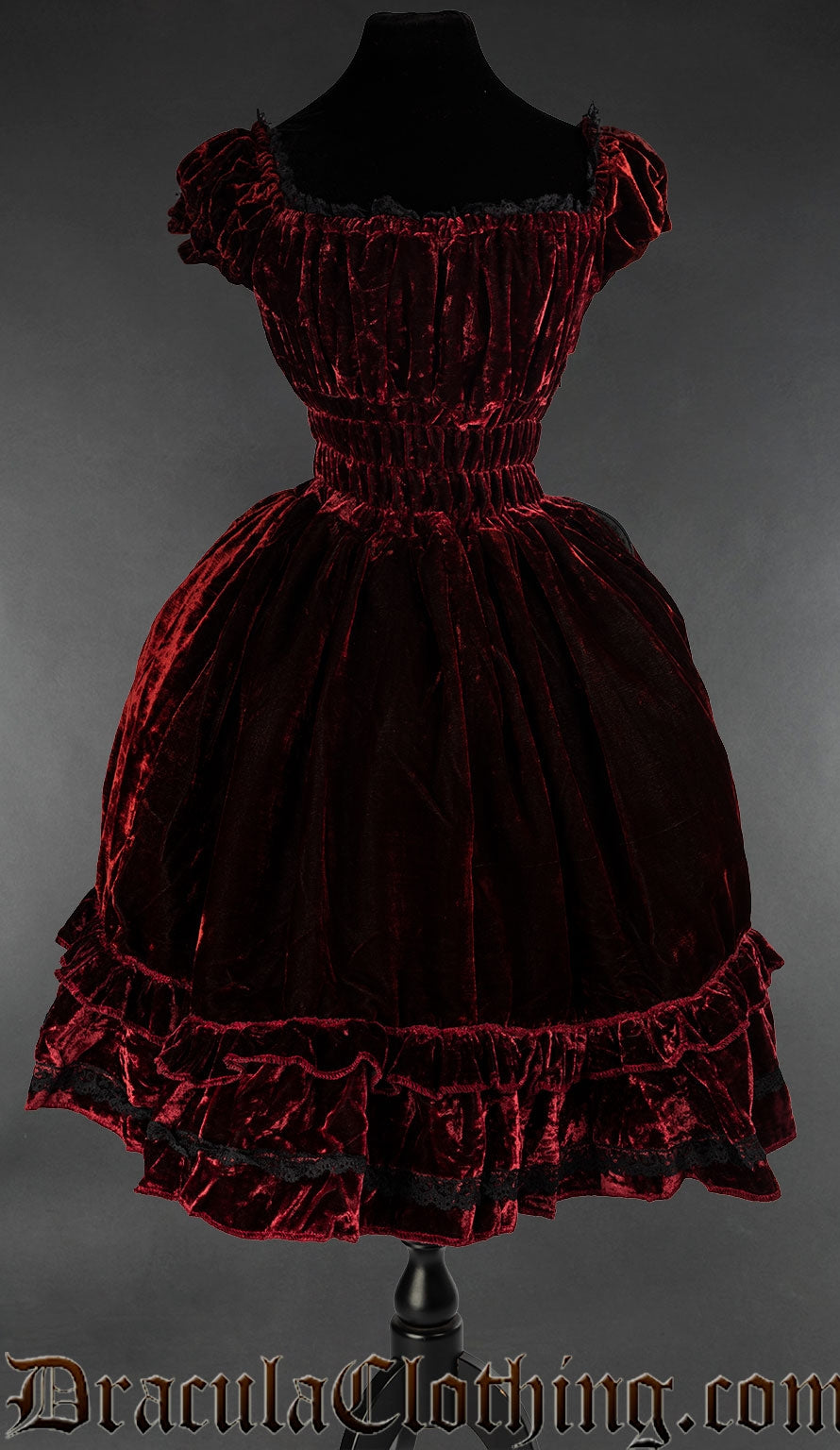Women's bordeaux red velvet dress with elasticated waist bust and sleeves and black lace trim