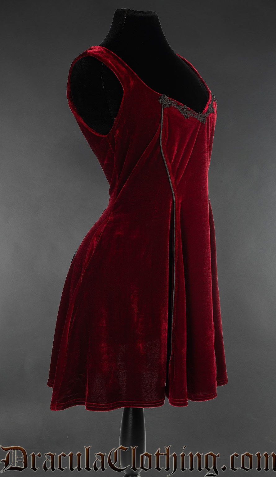 Women's short red velvet dress shown from the side