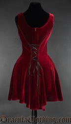 Back view of women's short sleeveless red velvet dress showing adjustable lacing in torso