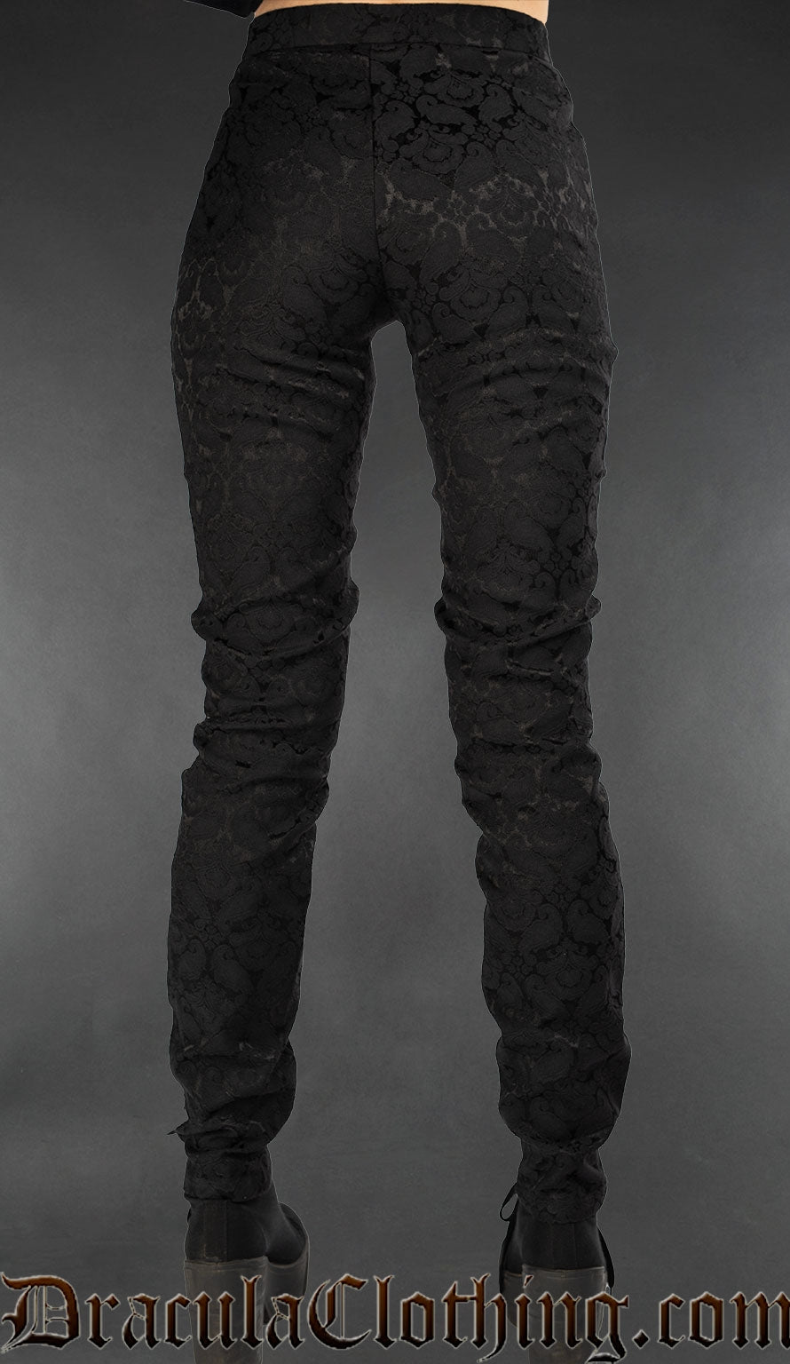 Back view of black brocade women's pants with lacing and ankh motif details