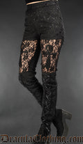 High waisted women's pants made from black brocade and sheer lace in the thigh with an ankh motif and lacing down the front of the leg