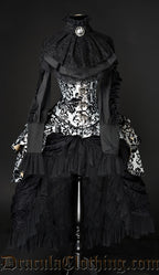 Women's black high waisted bustle skirt showed layered with an additional bustle corset and blouse