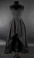Women's black high low dress with queen anne neckline and high neck collar made with woven cotton brocade fabric