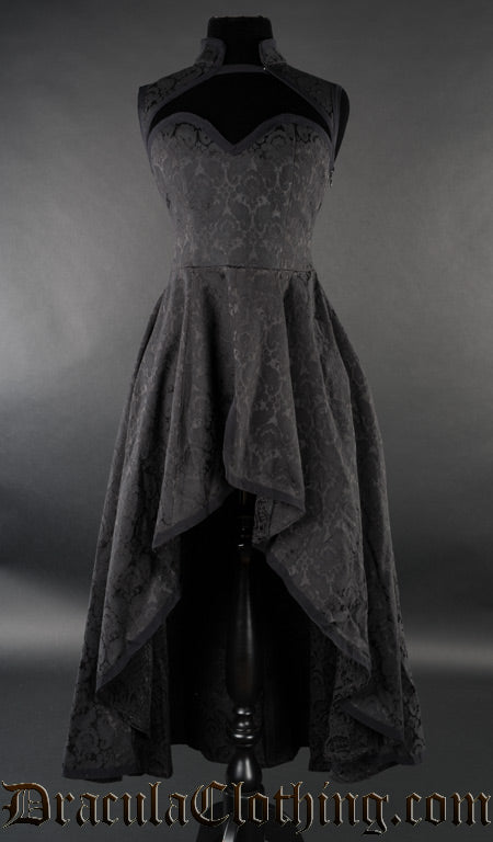 Women's black high low dress with queen anne neckline and high neck collar made with woven cotton brocade fabric