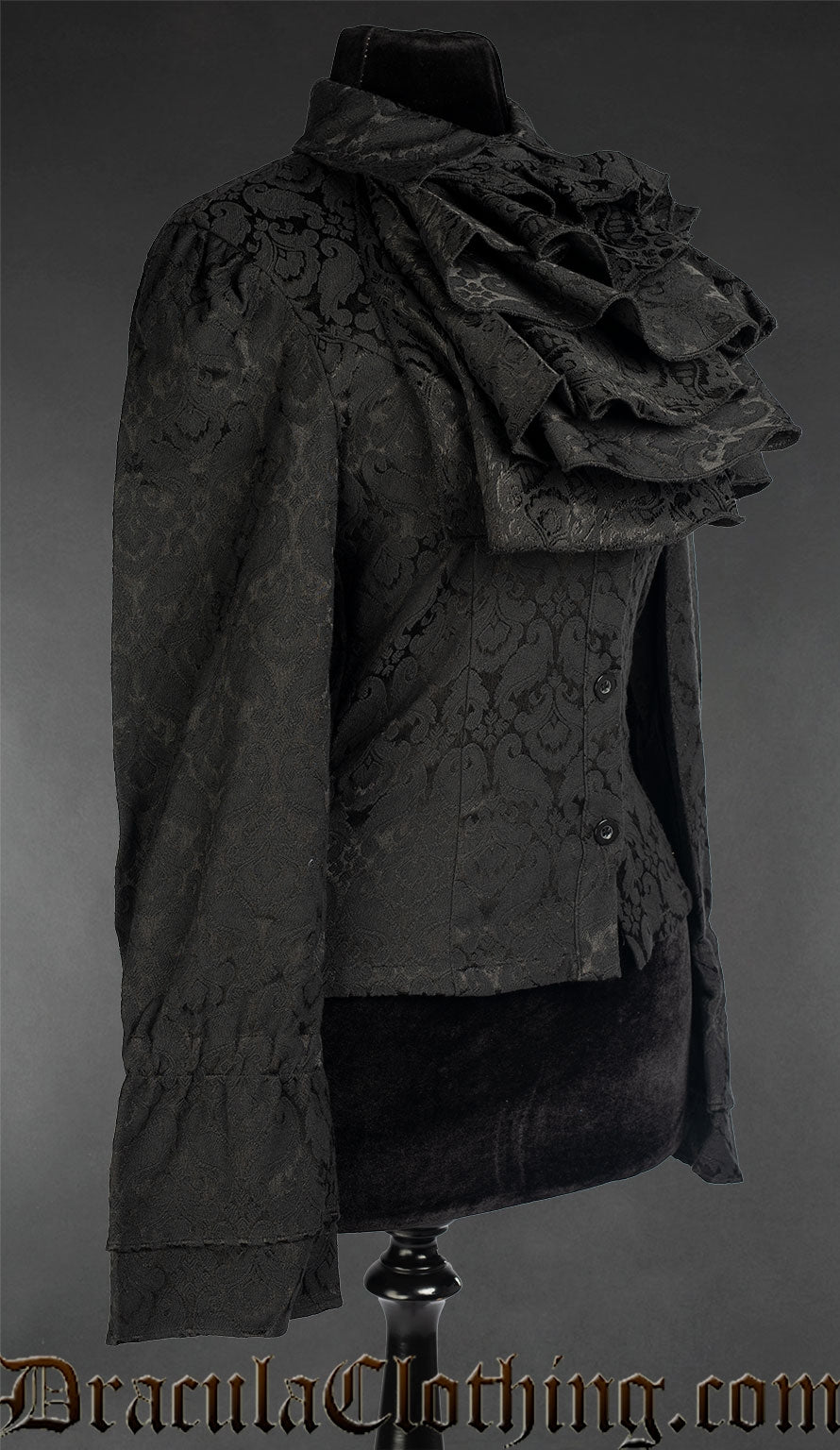 Side view of women's long sleeved black brocade blouse with cravat