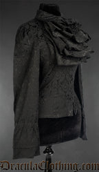 Side view of women's long sleeved black brocade blouse with cravat