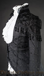 Close up side view of women's black brocade tailcoat showing detail of lace shoulders and decorative bead tassels