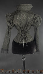Back view of black brocade jacket showing adjustable torso lacing and stiff high collar