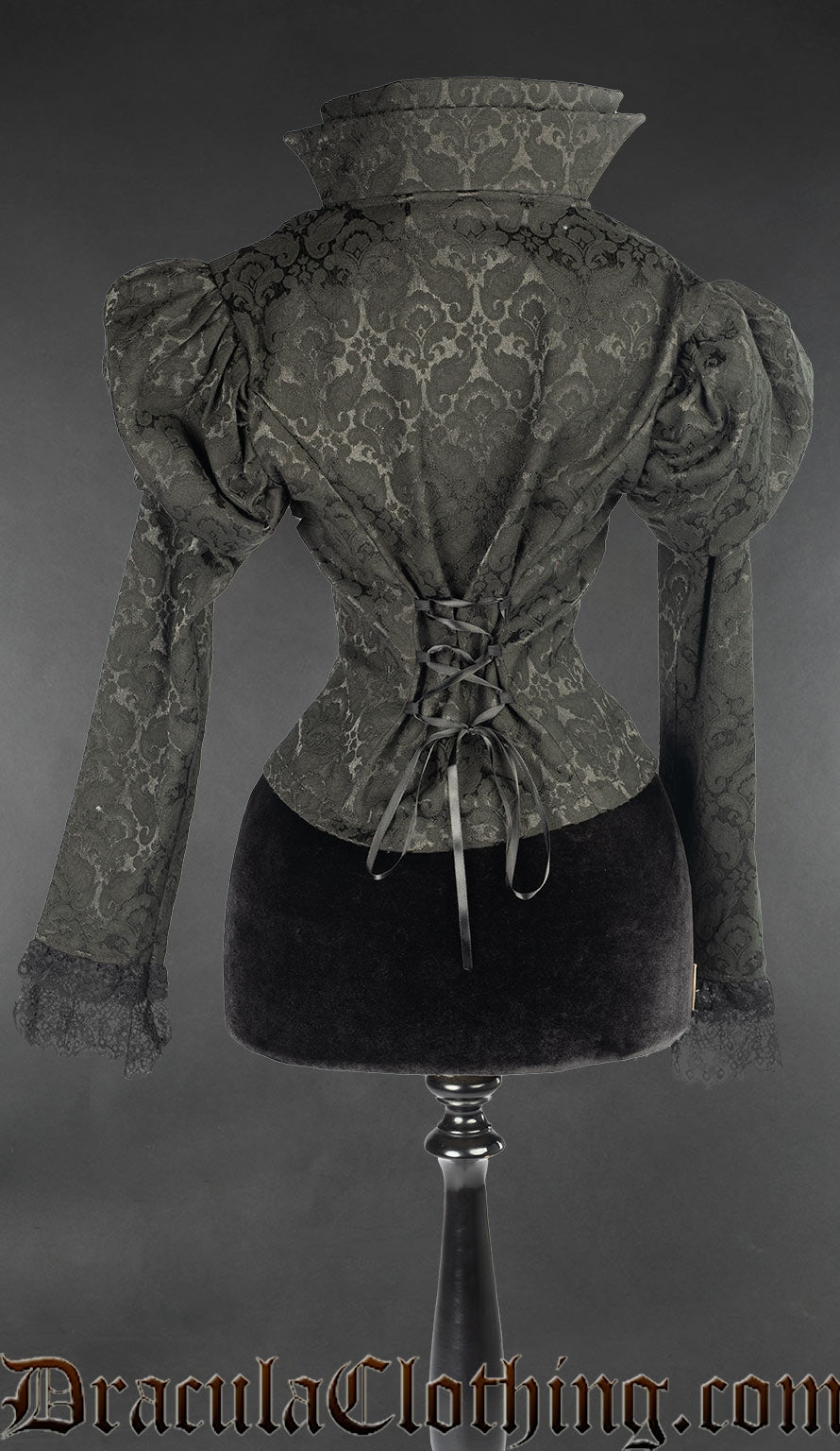 Back view of black brocade jacket showing adjustable torso lacing and stiff high collar