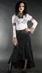 Model wearing white long sleeved lace top with skirt