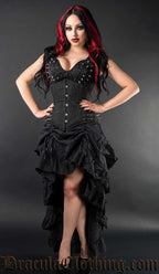 Model wearing women's brocade sleeveless top with silver spikes on the bust alongside matching spiked corset and bustle skirt