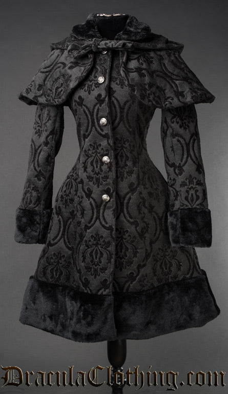 Women's black jacquard coat with faux fur hem accents and removable cape and hood