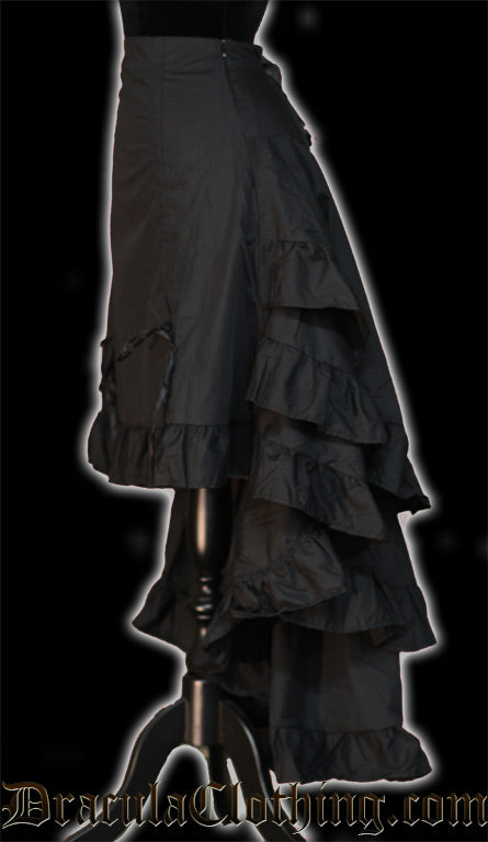 Side view of women's black layered bustle skirt showing the volume of many layers of fabric in the back