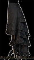 Side view of women's black layered bustle skirt showing the volume of many layers of fabric in the back