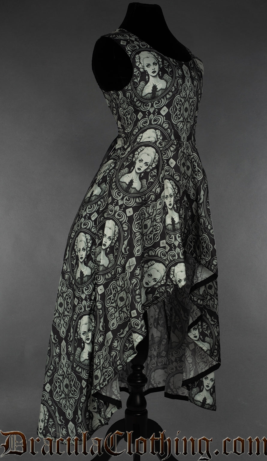 Side view of women's printed dress with cameo design showing the skirt length longer in the back than the front
