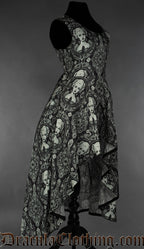 Side view of women's printed dress with cameo design showing the skirt length longer in the back than the front