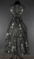 Back view of women's printed black dress with cameo portrait design showing adjustable corset style lacing at the back