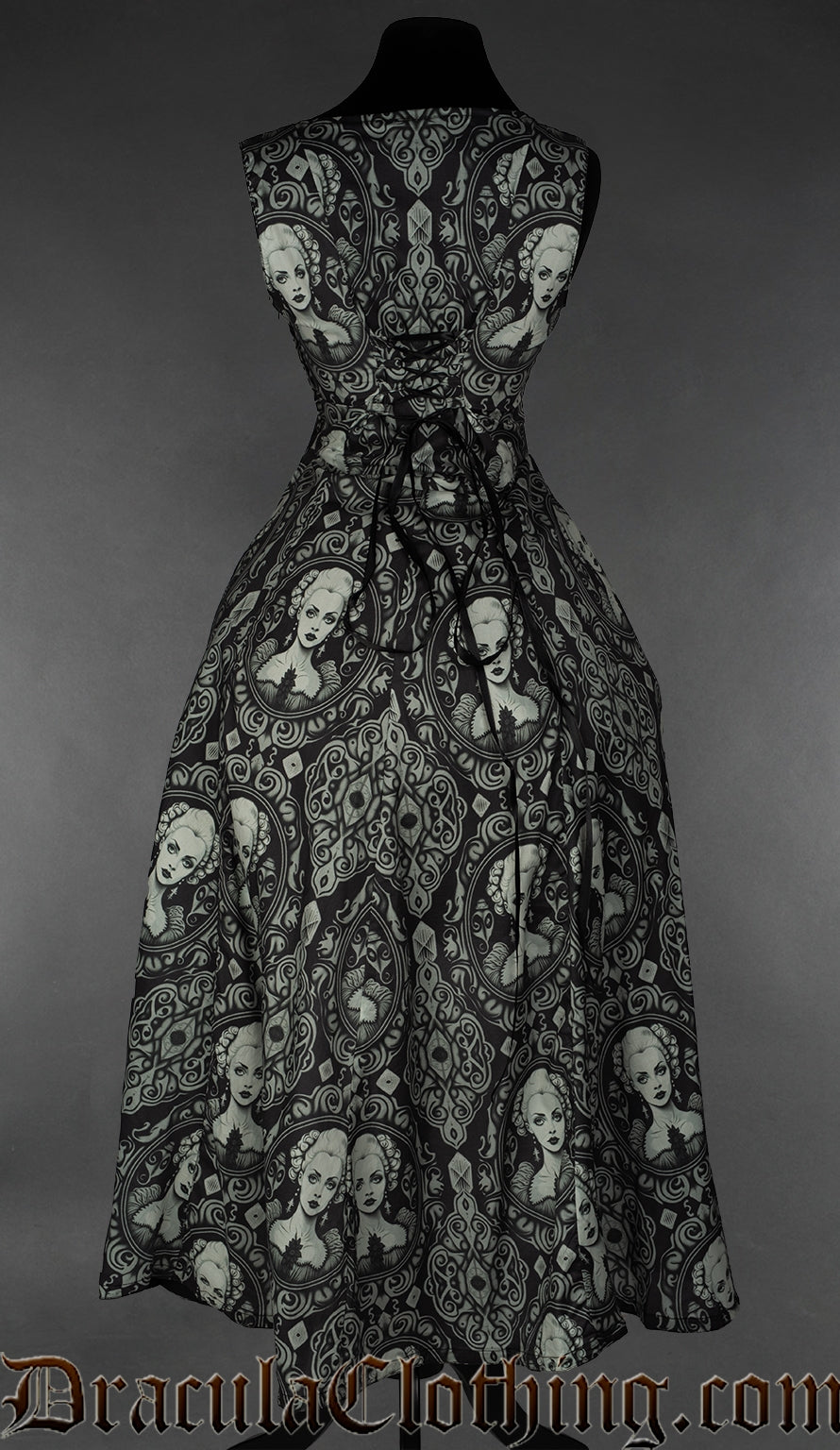 Back view of women's printed black dress with cameo portrait design showing adjustable corset style lacing at the back