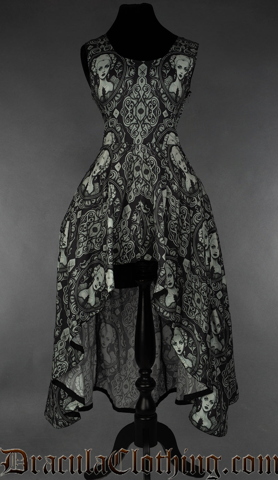 Women's sleeveless high low dress with printed cameo portrait design on a black background