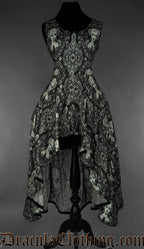 Women's sleeveless high low dress with printed cameo portrait design on a black background