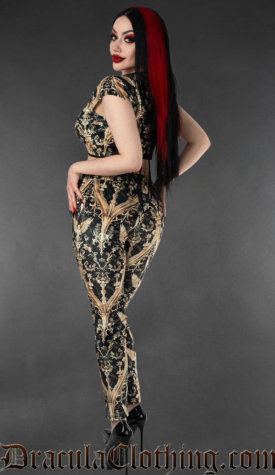Back view of cherub print black and gold velvet women's leggings