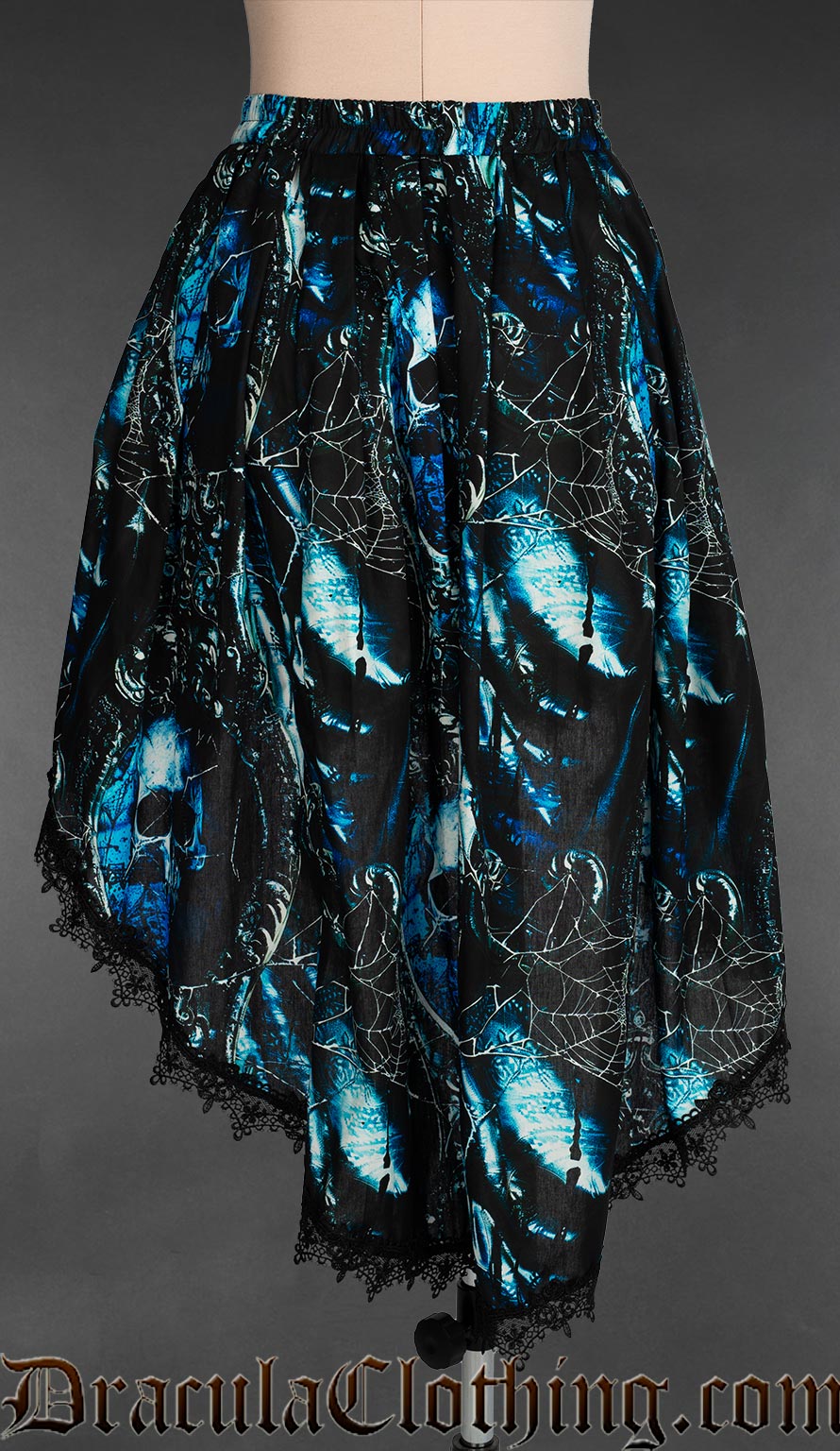 Back view of women's high low skirt with black lace trim and blue and black pirate skull inspired print