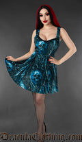 Model wearing a red and black gothic velvet skater dress with bat and cat print