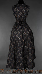 Back view of women's sleeveless black dress with dragon print showing adjustable corset style lacing