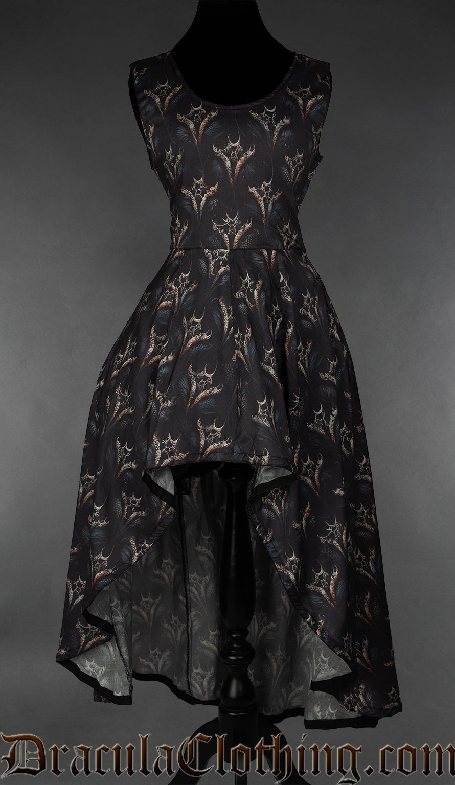 Women's high low sleeveless dress with printed dragon design on a black background