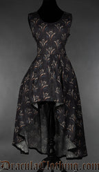 Women's high low sleeveless dress with printed dragon design on a black background
