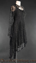 Side view of women's black lace dress showing high low skirt style and trumpet sleeves of detachable bolero