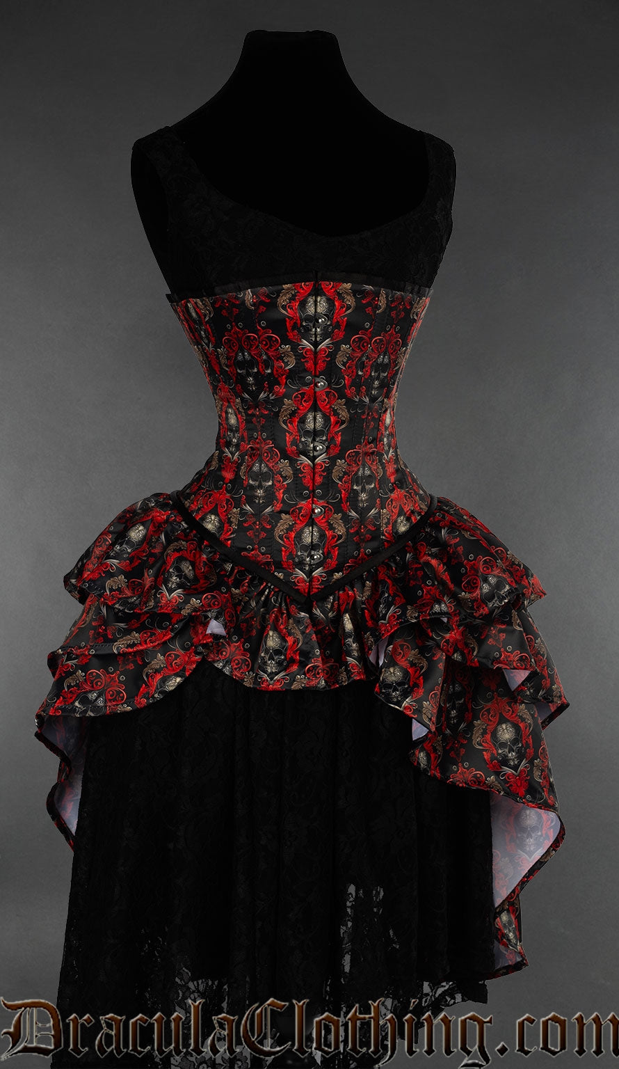 Women's underbust corset with red and black ornate skull design and attached layered bustle skirt