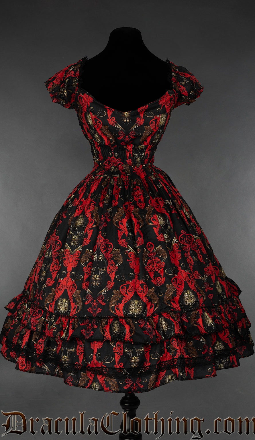 Back view of women's skull print red and black knee length dress showing elasticated waist