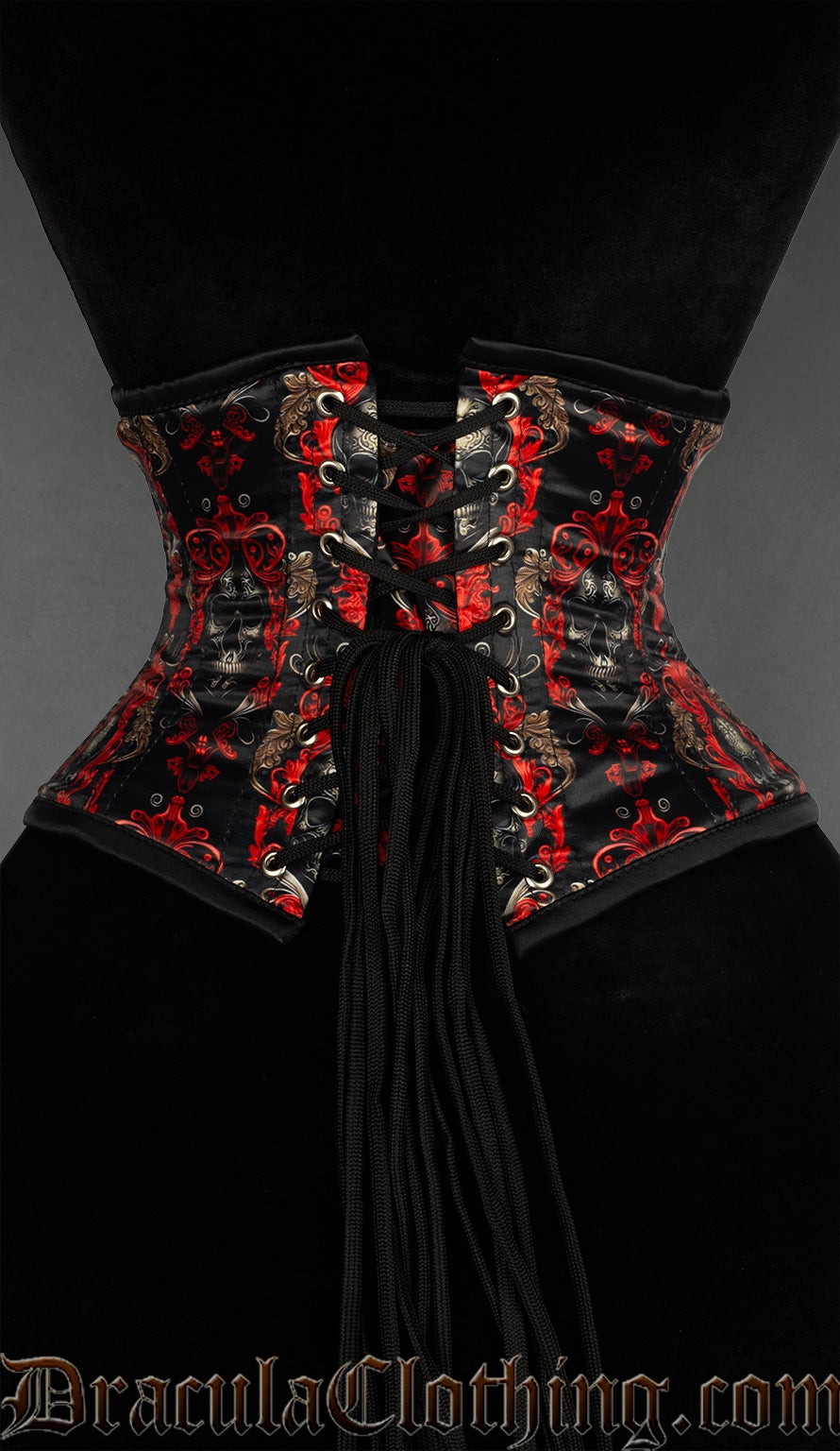 Back view of red and black ornate skull print waist cincher showing matching printed modesty panel and adjustable lacing