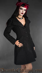 Black embroidered wool coat with fitted silhouette, button front, and decorative gothic detailing worn by model