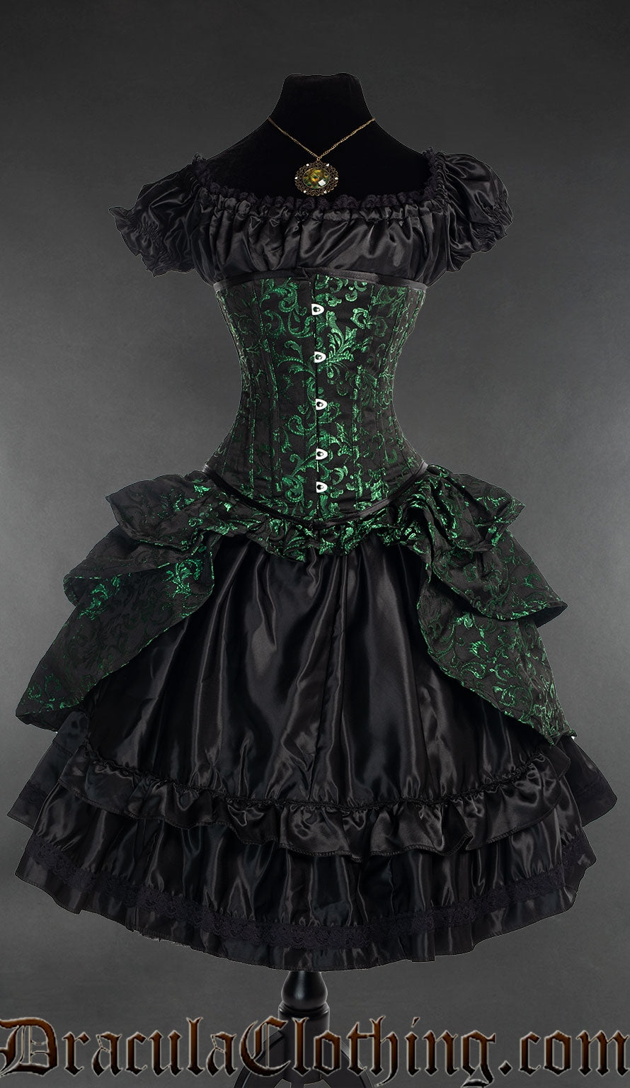 Black corset with bustle attachment and woven green brocade details shown over a black satin dress