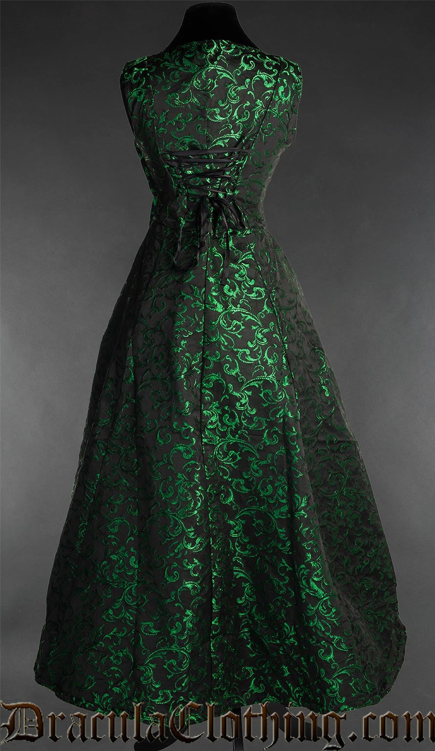 Back view of women's black and green brocade dress showing adjustable corset-style lacing in the torso