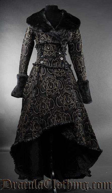 Gold, black and grey brocade women's coat in a high low style with wrap closure and faux fur accents on the sleeve cuffs and collar