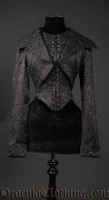 Women's black brocade jacket shown with dramatic large collar folded down