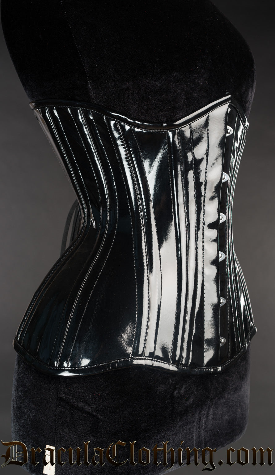 Side view of black PVC corset showing extreme waist style shaping