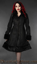 Women's knee length black coat with black faux fur accents and piping details
