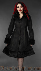 Women's knee length black coat with black faux fur accents and piping details
